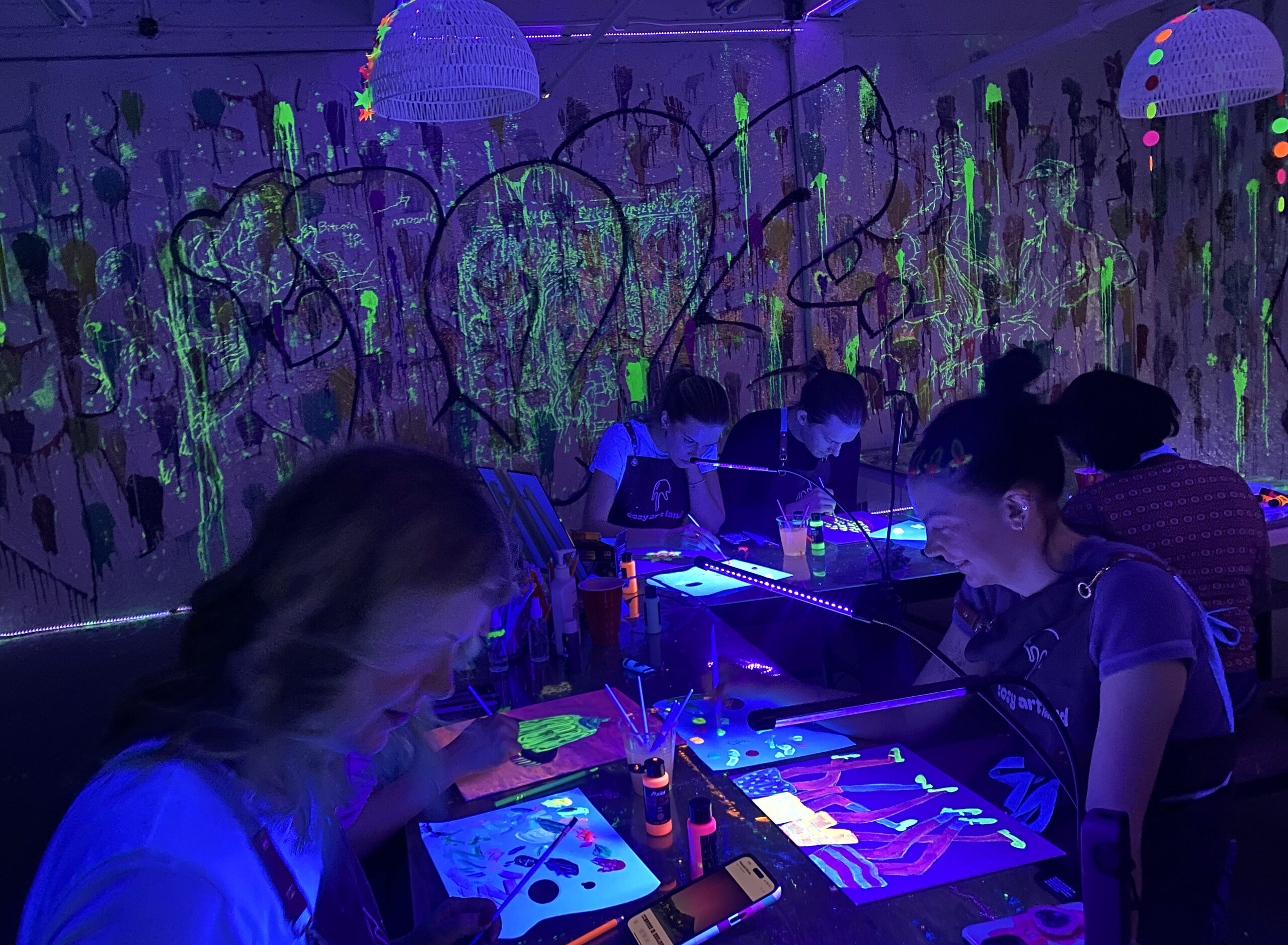 Adults painting together at Cozy Art Land in Long Island City