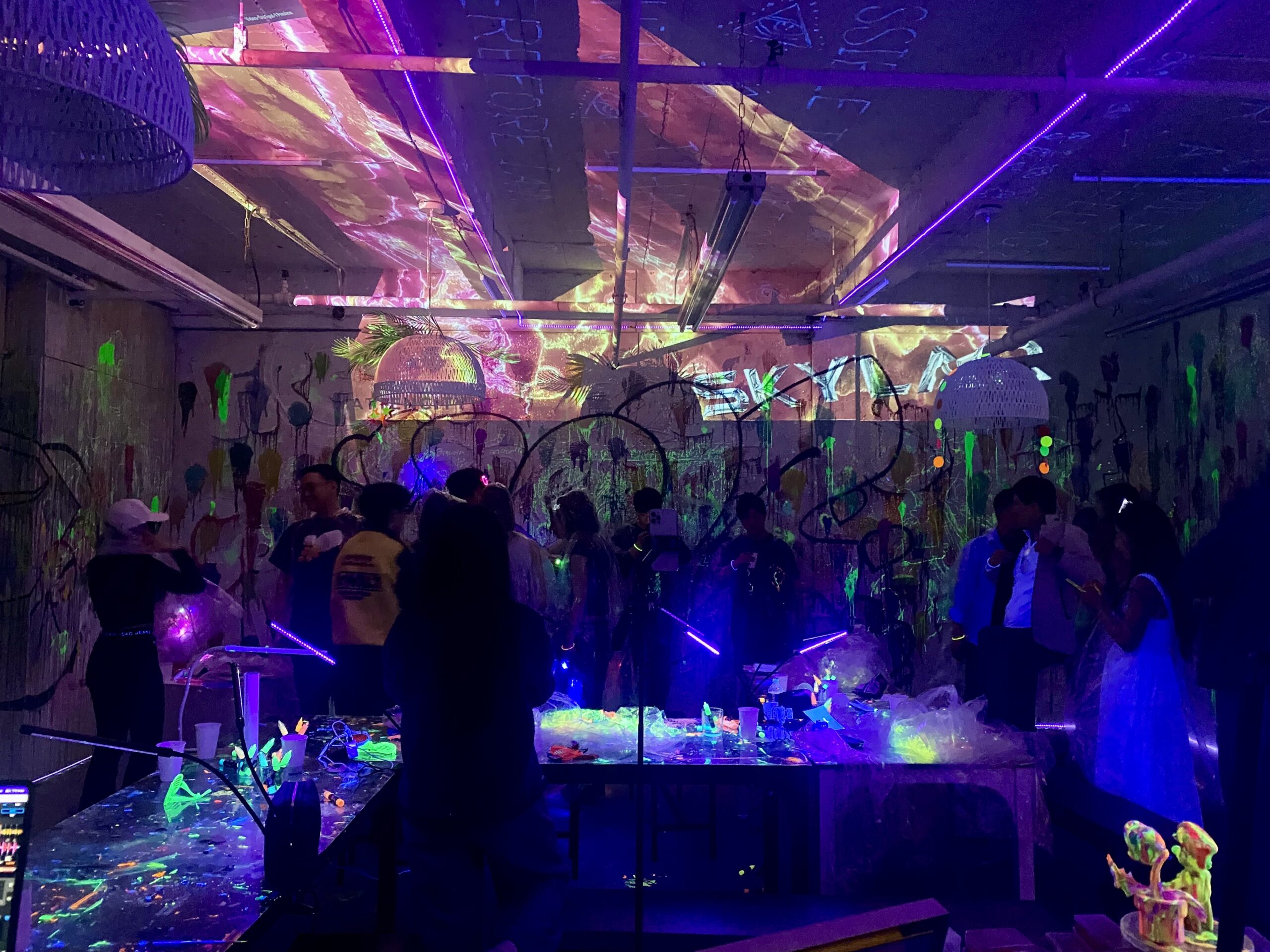 Glow paint in the dark activity for a teen field trip group